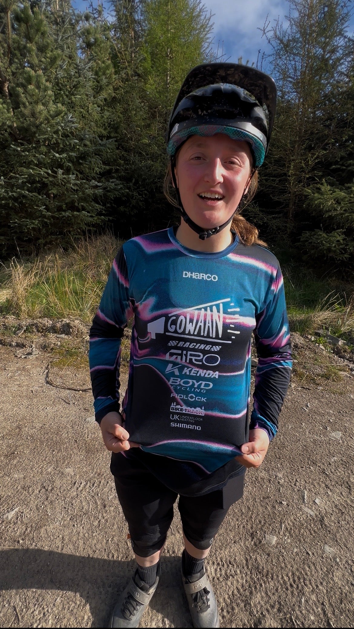 Chloe wearing the new Gowaan Racing Dharco jersey in blue and black